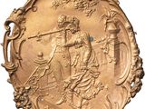 an image of a gold plate with a picture of a man and a woman on it