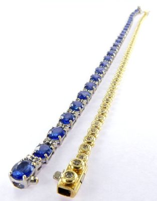 a close up of two necklaces on a white surface