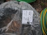 a plastic bag with a label on it sitting on the ground