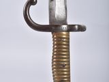a close up of a knife hanging on a wall