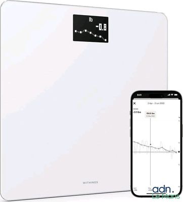 an image of a white bathroom scale with a cell phone next to it