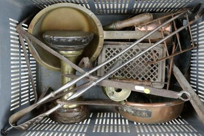 a basket full of old tools and utensils in it