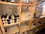 many bottles of wine on the shelves in the cellar