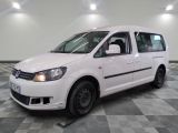 a picture of a white van parked on a checkered floor