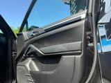 a close up of the door of a car with the driver ' s door open
