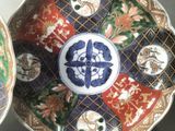 three plates with different designs on them on a table