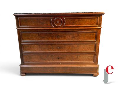 a wooden chest of drawers with a marble top