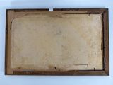 an old picture of a piece of paper in a wooden frame