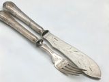 two forks and spoons sitting on a table