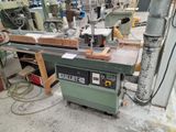 a picture of a machine that is working on a piece of wood