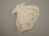 an image of a white dress hanging on a wall