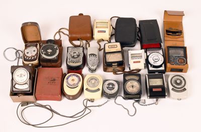 many different types of old fashioned phones on a white surface