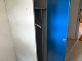 a blue door in the corner of a room