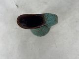 a small vase that is sitting in the snow