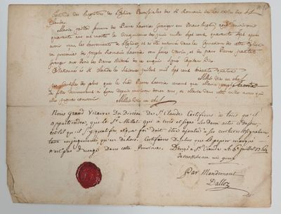 un gros plan d'une feuille de papier portant un cachet de cire