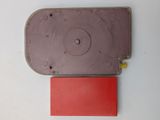 a red piece of paper on the table next to a red piece of paper