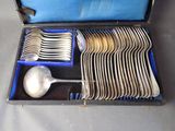 silverware in a case with spoons and spoons in it