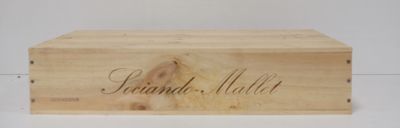 a wooden box that has a name written on it