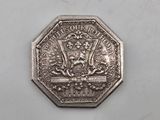 a close up of a silver coin with a lion on it