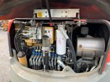an image of a car with a bunch of wires in the trunk
