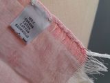 a close up of a pink dress with a label on it