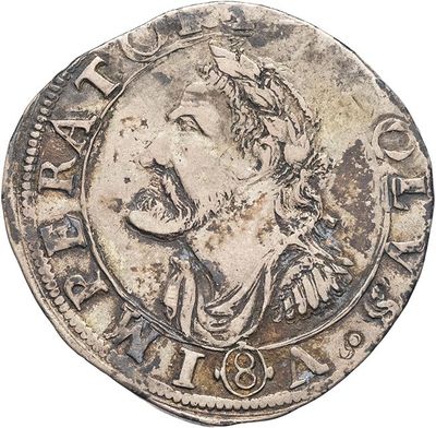 a close up of a coin with an image of a man on it
