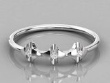 a close up of a diamond ring on a reflective surface