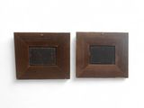 pair of antique wooden picture frames with a blackboard in the middle