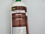 a bottle of cleaner sitting on a table