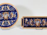 two pieces of blue and gold plate with a lion on it