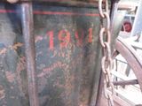 a close up of a horse drawn carriage with a chain on it