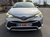 the front of a silver toyota corollant parked in a parking lot