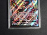 a close up of a pokemon card on a table