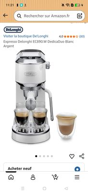 an image of a coffee machine with two cups and a cup of coffee