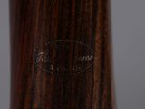 an image of a close up of a wooden stick with a logo on it