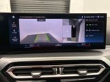 the dashboard of a car with a view of a car ' s rear view camera