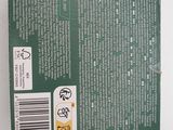 the back of a green box with a white label on it