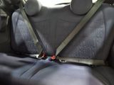 a seat belt that is attached to the back of a car