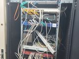 a rack with many wires in it in a room