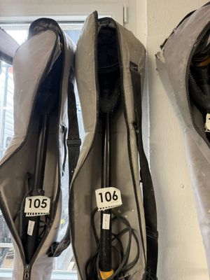 two bags that are hanging on the wall next to each other