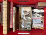 many old books in a red box on the table