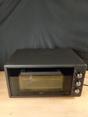 an image of a toaster oven sitting on a table