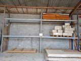 a room that has a lot of shelves and pallets in it