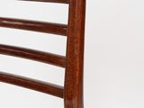 a wooden chair with a wooden seat on a white background