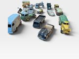 a lot of toy cars that are on a white surface