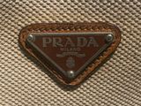 the prada logo is on the side of a brown bag