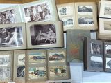 a lot of old photos on the table