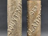 a pair of antique brass vases with carvings on them