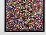 an abstract painting of multicolored paint on a white wall