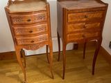 two wooden tables with drawers on them in a room